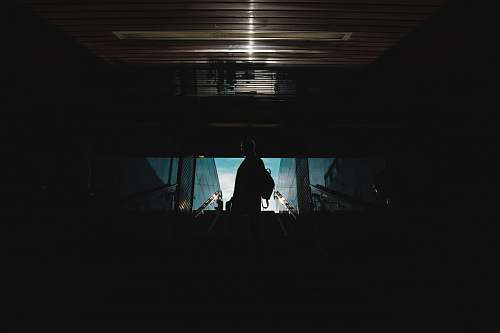 interior design silhouette of person standing inside building indoors